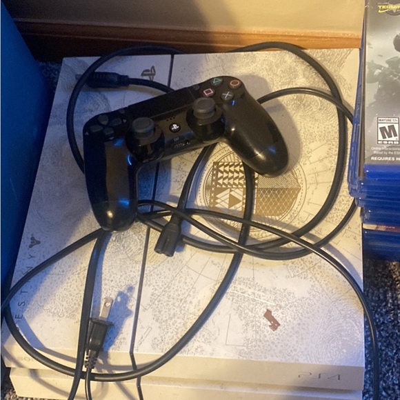 White ps4 with controller and games